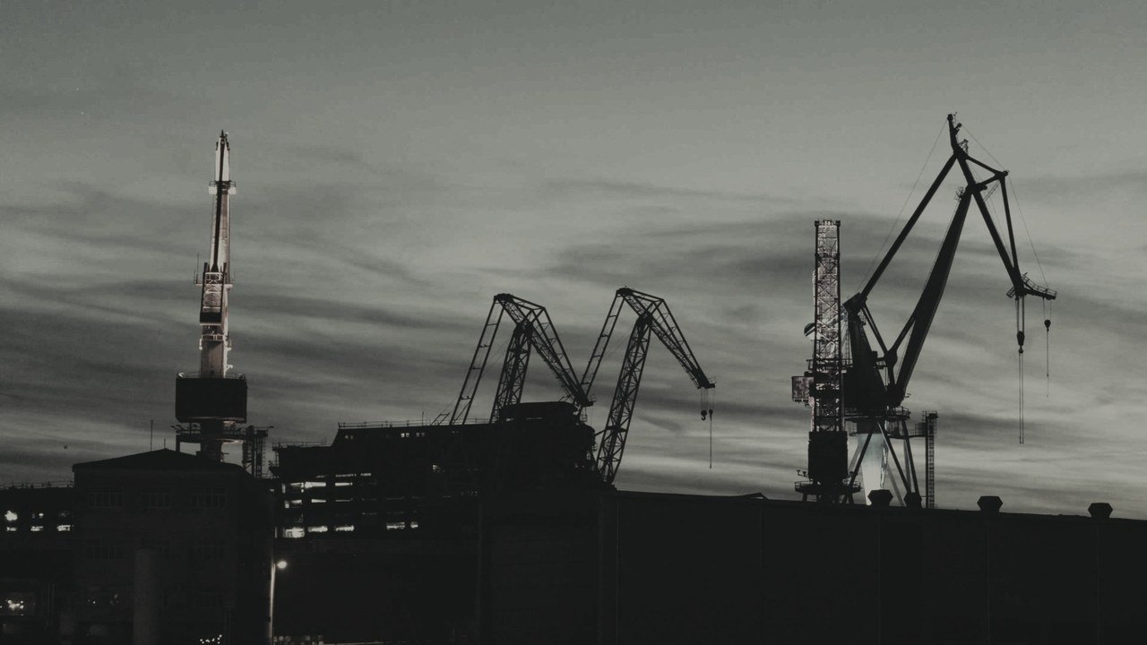 Shipyard cranes at night